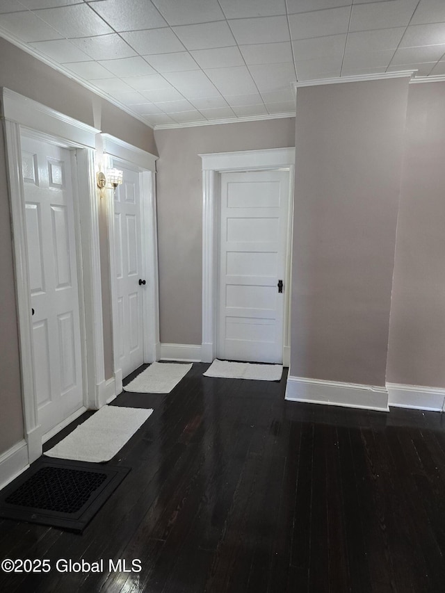 1117 Mcclellan St, Schenectady, NY 12309 - entryway with ornamental molding, baseboards, and dark wood-style flooring