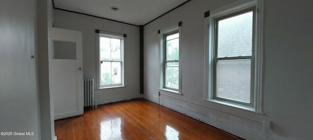 148 Dove St, Albany, NY 12202 - spare room with radiator and wood finished floors
