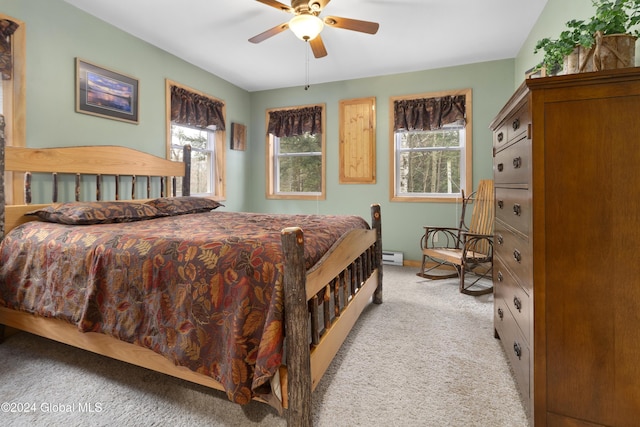 12 Birch Pl, Day, NY 12835 - bedroom featuring light colored carpet, a baseboard heating unit, and a ceiling fan