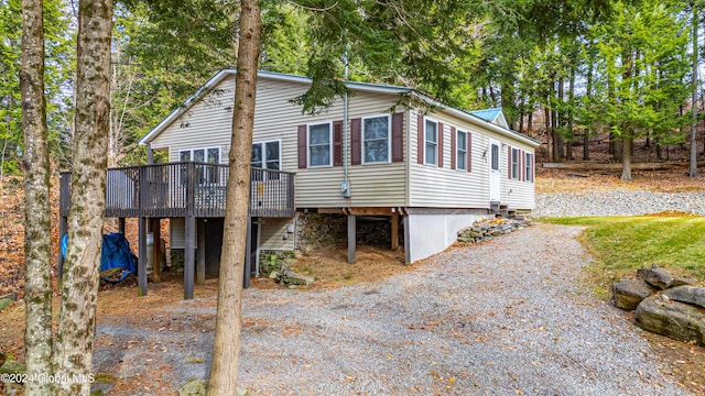 12 Birch Pl, Day, NY 12835 - view of front of property with a wooden deck and gravel driveway