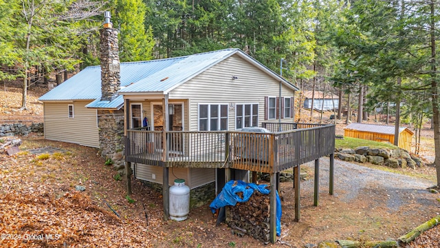 12 Birch Pl, Day, NY 12835 - rear view of house with a wooden deck and metal roof