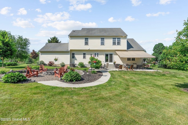 11 Lucille Ln, Malta, NY 12019 - back of property with a patio, an outdoor fire pit, and a lawn