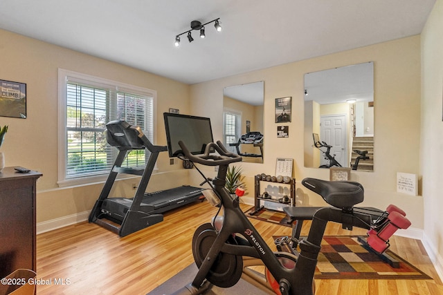 11 Lucille Ln, Malta, NY 12019 - workout area with wood finished floors, healthy amount of natural light, and baseboards