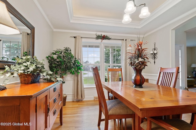 11 Lucille Ln, Malta, NY 12019 - dining space with a chandelier, a raised ceiling, light wood-style floors, and ornamental molding