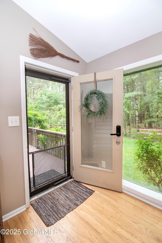 124 Edie Rd, Wilton, NY 12866 - doorway to outside featuring wood finished floors and lofted ceiling