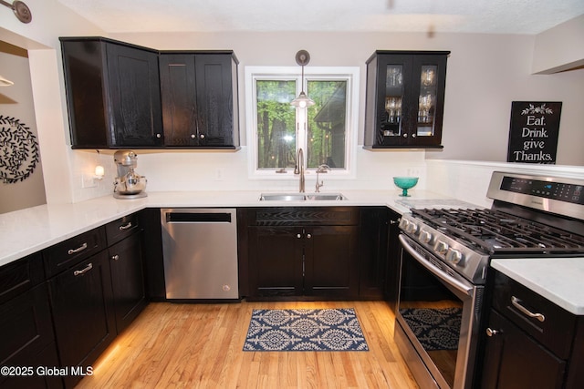 124 Edie Rd, Wilton, NY 12866 - kitchen with stainless steel appliances, light wood finished floors, backsplash, and light countertops