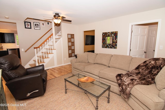 124 Edie Rd, Wilton, NY 12866 - living area with wood finished floors, stairs, and a ceiling fan
