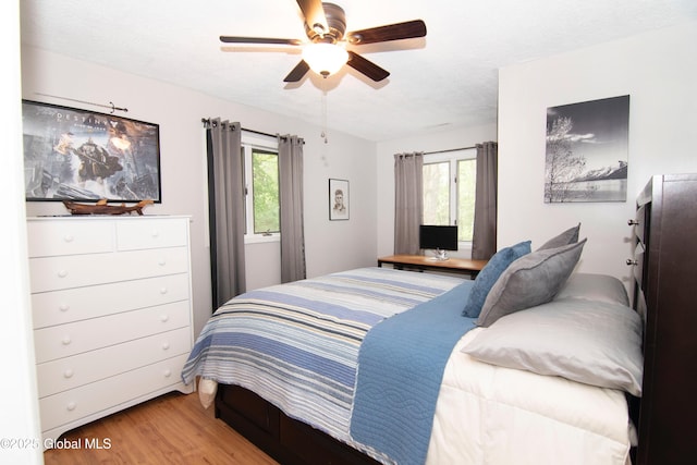 124 Edie Rd, Wilton, NY 12866 - bedroom featuring wood finished floors, multiple windows, and a ceiling fan