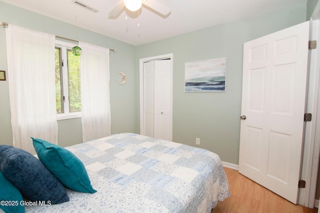 124 Edie Rd, Wilton, NY 12866 - bedroom with light wood-style floors, a closet, and a ceiling fan