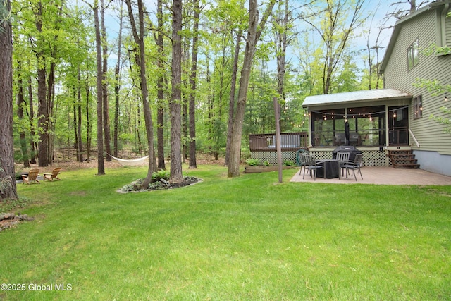 124 Edie Rd, Wilton, NY 12866 - view of green lawn featuring a sunroom and a patio area