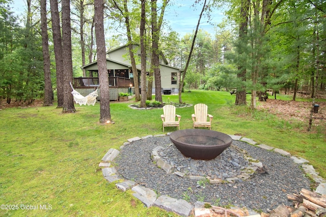 124 Edie Rd, Wilton, NY 12866 - view of grassy yard featuring an outdoor fire pit and a sunroom