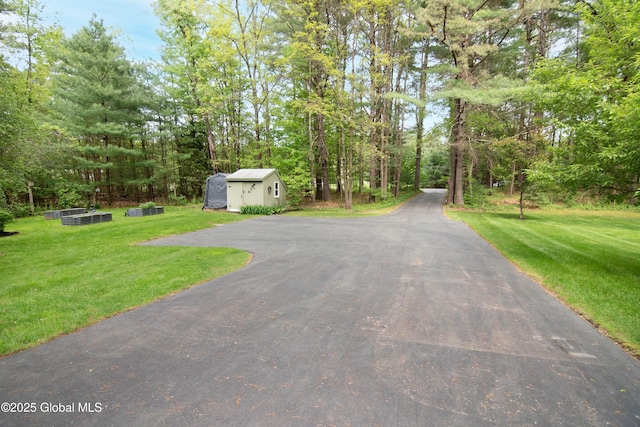 124 Edie Rd, Wilton, NY 12866 - view of asphalt road featuring a view of trees
