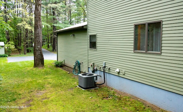 124 Edie Rd, Wilton, NY 12866 - view of side of property featuring a central air condition unit and a lawn