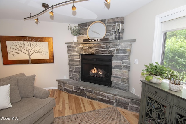 124 Edie Rd, Wilton, NY 12866 - living area with a fireplace and wood finished floors