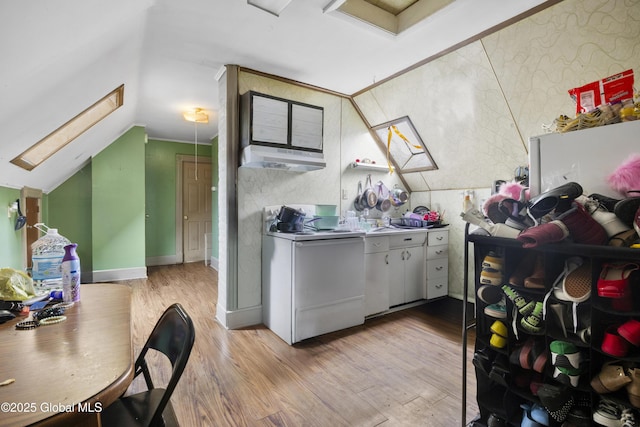 12 Mynderse St, Schenectady, NY 12307 - kitchen with electric stove, light wood-style flooring, a skylight, under cabinet range hood, and lofted ceiling
