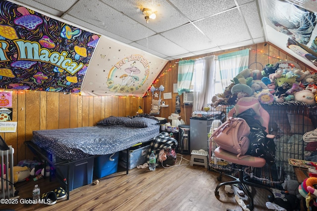 12 Mynderse St, Schenectady, NY 12307 - bedroom with wood finished floors, wooden walls, lofted ceiling, and a drop ceiling