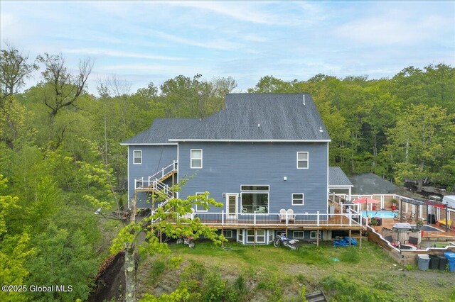 14 Calvin Cole Rd, Stephentown, NY 12169 - rear view of house featuring a view of trees and a wooden deck
