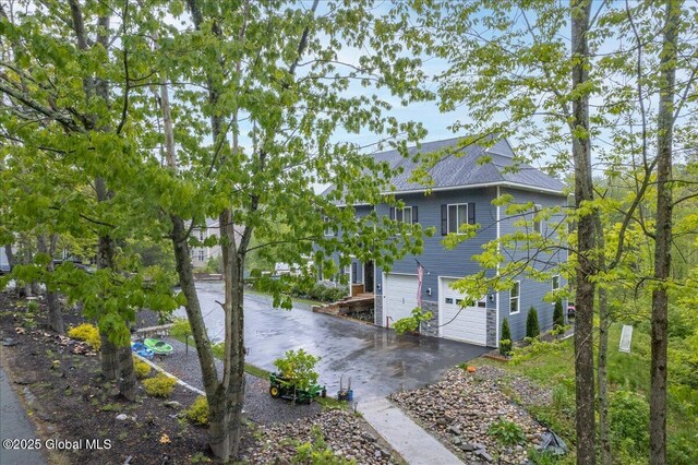 14 Calvin Cole Rd, Stephentown, NY 12169 - view of side of home featuring concrete driveway and an attached garage