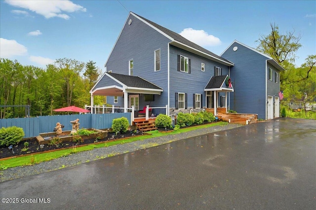 14 Calvin Cole Rd, Stephentown, NY 12169 - rear view of house with asphalt driveway, a garage, and a deck