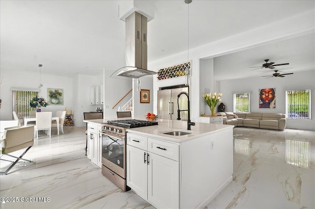 14 Calvin Cole Rd, Stephentown, NY 12169 - kitchen featuring appliances with stainless steel finishes, a sink, island range hood, light marble finish flooring, and white cabinetry