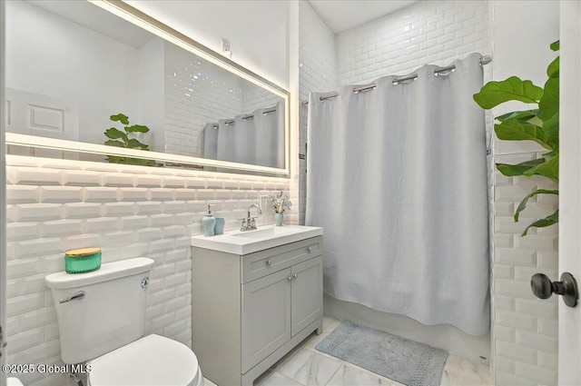 14 Calvin Cole Rd, Stephentown, NY 12169 - full bathroom with marble look tiles, vanity, toilet, shower / tub combo with curtain, and backsplash