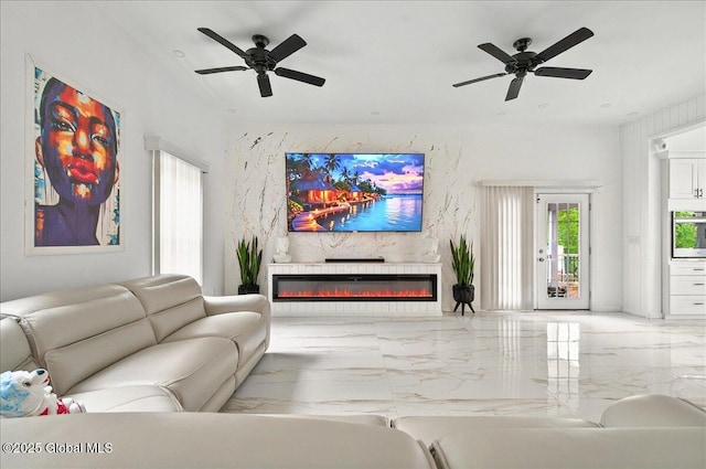 14 Calvin Cole Rd, Stephentown, NY 12169 - living area with marble tiled floors, ceiling fan, and a glass covered fireplace