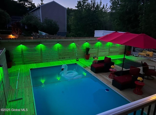 14 Calvin Cole Rd, Stephentown, NY 12169 - pool at dusk with a wooden deck and a fenced backyard
