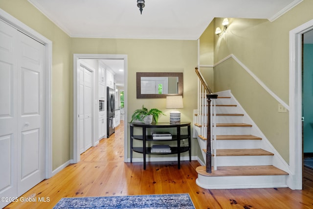 9 Longwood Dr, Saratoga Springs, Inside, NY 12866 - foyer entrance featuring stairs, light wood-style flooring, and ornamental molding