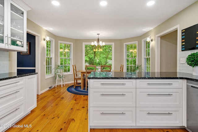 9 Longwood Dr, Saratoga Springs, Inside, NY 12866 - kitchen with stainless steel dishwasher, white cabinets, a chandelier, glass insert cabinets, and recessed lighting