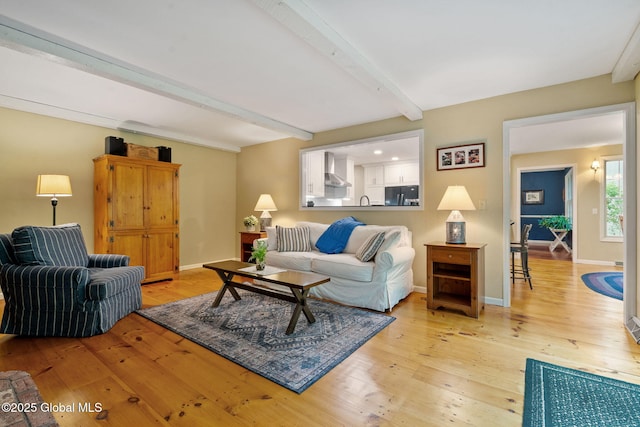 9 Longwood Dr, Saratoga Springs, Inside, NY 12866 - living area featuring beamed ceiling and light wood finished floors
