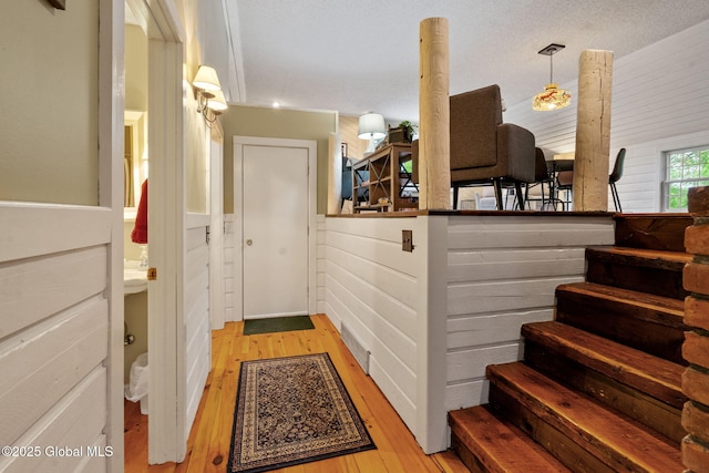 9 Longwood Dr, Saratoga Springs, Inside, NY 12866 - hall with wood-type flooring, a wainscoted wall, and stairs