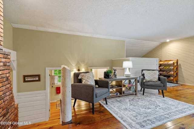 9 Longwood Dr, Saratoga Springs, Inside, NY 12866 - sitting room with a textured ceiling, hardwood / wood-style flooring, lofted ceiling, and wooden walls