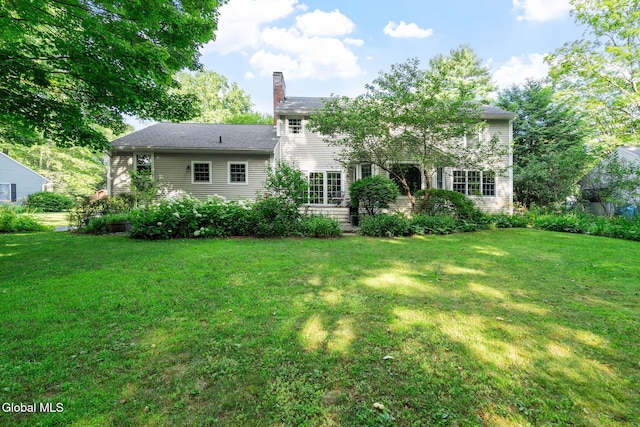 9 Longwood Dr, Saratoga Springs, Inside, NY 12866 - back of property with a lawn and a chimney