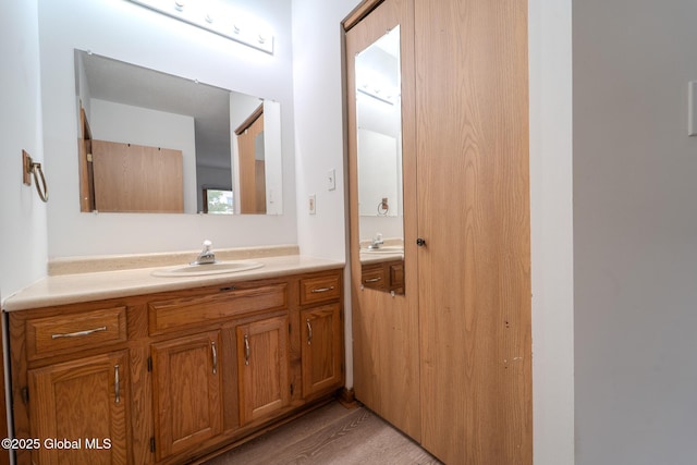 1976 Curry Rd Unit E-136, Schenectady, NY 12303 - bathroom with vanity and wood finished floors