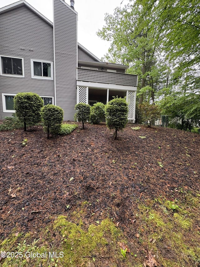 1976 Curry Rd Unit E-136, Schenectady, NY 12303 - view of side of home featuring a chimney