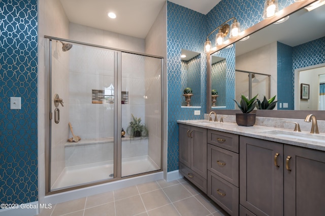 12 Anson Ct, Malta, NY 12020 - bathroom with tile patterned floors, a shower stall, double vanity, and baseboards