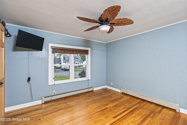 2044 Caldicott Rd, Rotterdam, NY 12303 - spare room with baseboard heating, light wood-style flooring, ceiling fan, ornamental molding, and baseboards