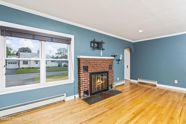 2044 Caldicott Rd, Rotterdam, NY 12303 - unfurnished living room with a baseboard radiator, a fireplace, arched walkways, ornamental molding, and recessed lighting