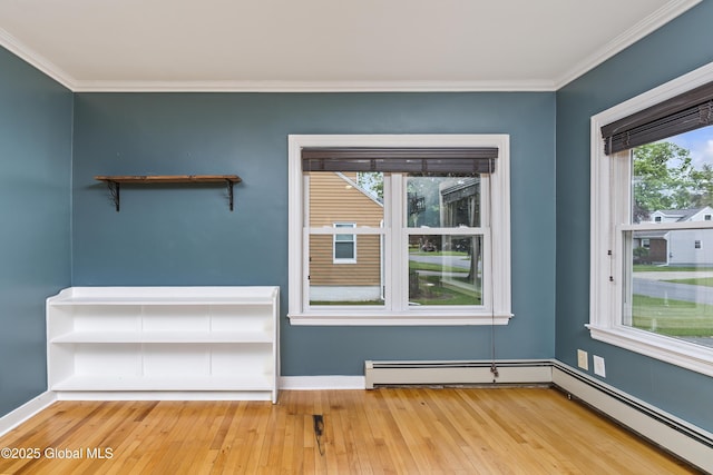 2044 Caldicott Rd, Rotterdam, NY 12303 - spare room featuring crown molding, wood-type flooring, a baseboard radiator, and baseboards