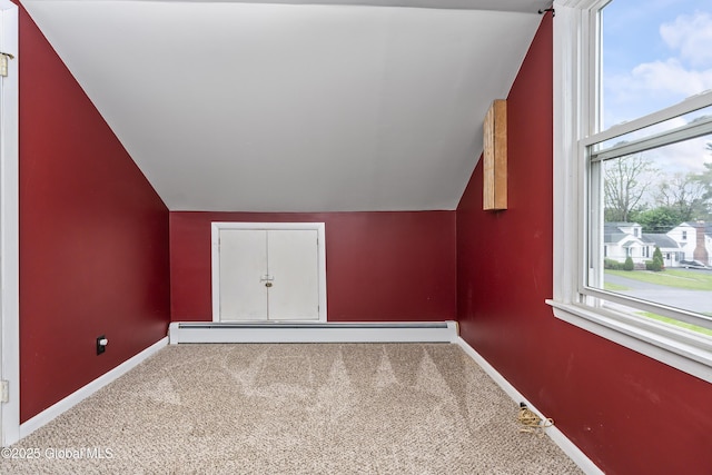 2044 Caldicott Rd, Rotterdam, NY 12303 - additional living space featuring vaulted ceiling, baseboard heating, carpet, and baseboards