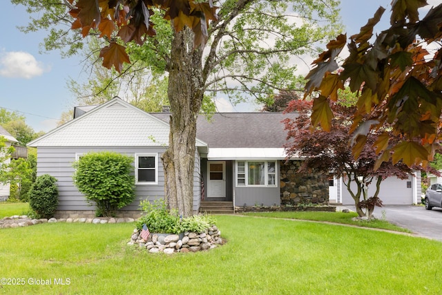 184 Main St, South Glens Falls, NY 12803 - view of front of home featuring a front yard, entry steps, a garage, and driveway