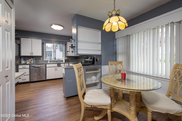184 Main St, South Glens Falls, NY 12803 - kitchen with stainless steel dishwasher, white cabinetry, dark wood-style flooring, and dark countertops
