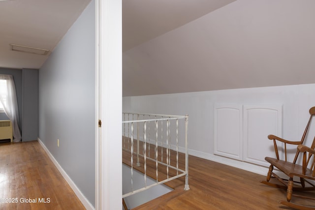 184 Main St, South Glens Falls, NY 12803 - hall featuring wood finished floors, attic access, baseboards, and an upstairs landing