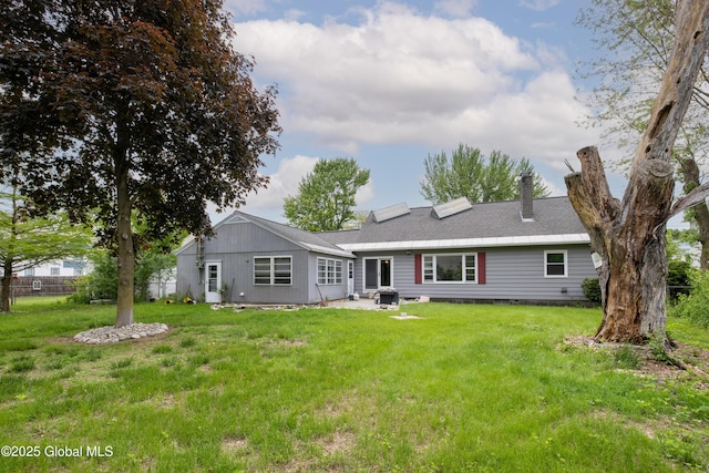 184 Main St, South Glens Falls, NY 12803 - rear view of house with a chimney, a shingled roof, and a patio area