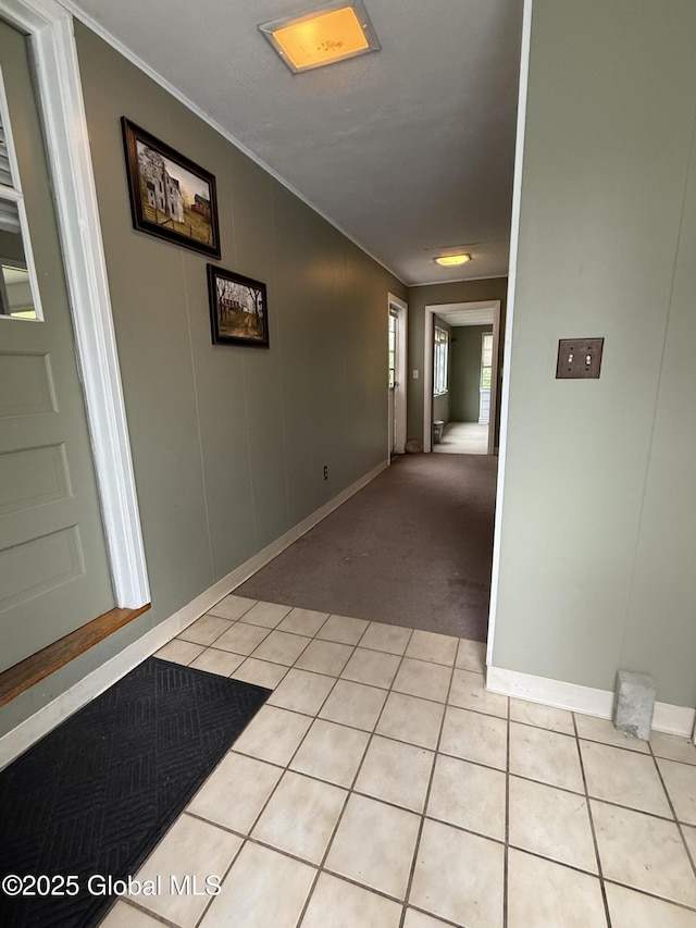184 Main St, South Glens Falls, NY 12803 - hall featuring crown molding, light tile patterned floors, baseboards, and light carpet