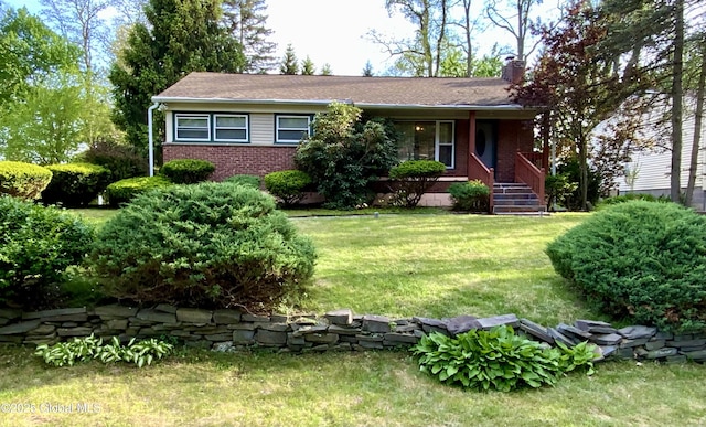 6 Kenyon Dr, Colonie, NY 12205 - ranch-style house featuring brick siding, a chimney, and a front yard