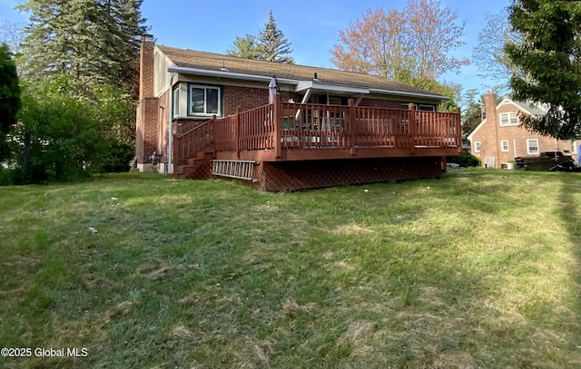 6 Kenyon Dr, Colonie, NY 12205 - back of house with a chimney, a wooden deck, a yard, and brick siding