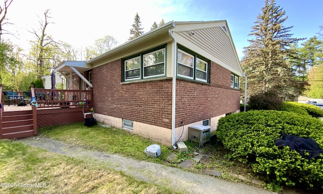 6 Kenyon Dr, Colonie, NY 12205 - view of side of property with brick siding and a wooden deck