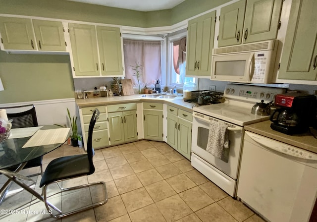 6 Kenyon Dr, Colonie, NY 12205 - kitchen with white appliances, a sink, light countertops, and light tile patterned floors