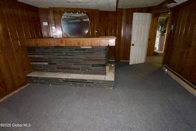 6 Kenyon Dr, Colonie, NY 12205 - unfurnished living room featuring wood walls and carpet flooring